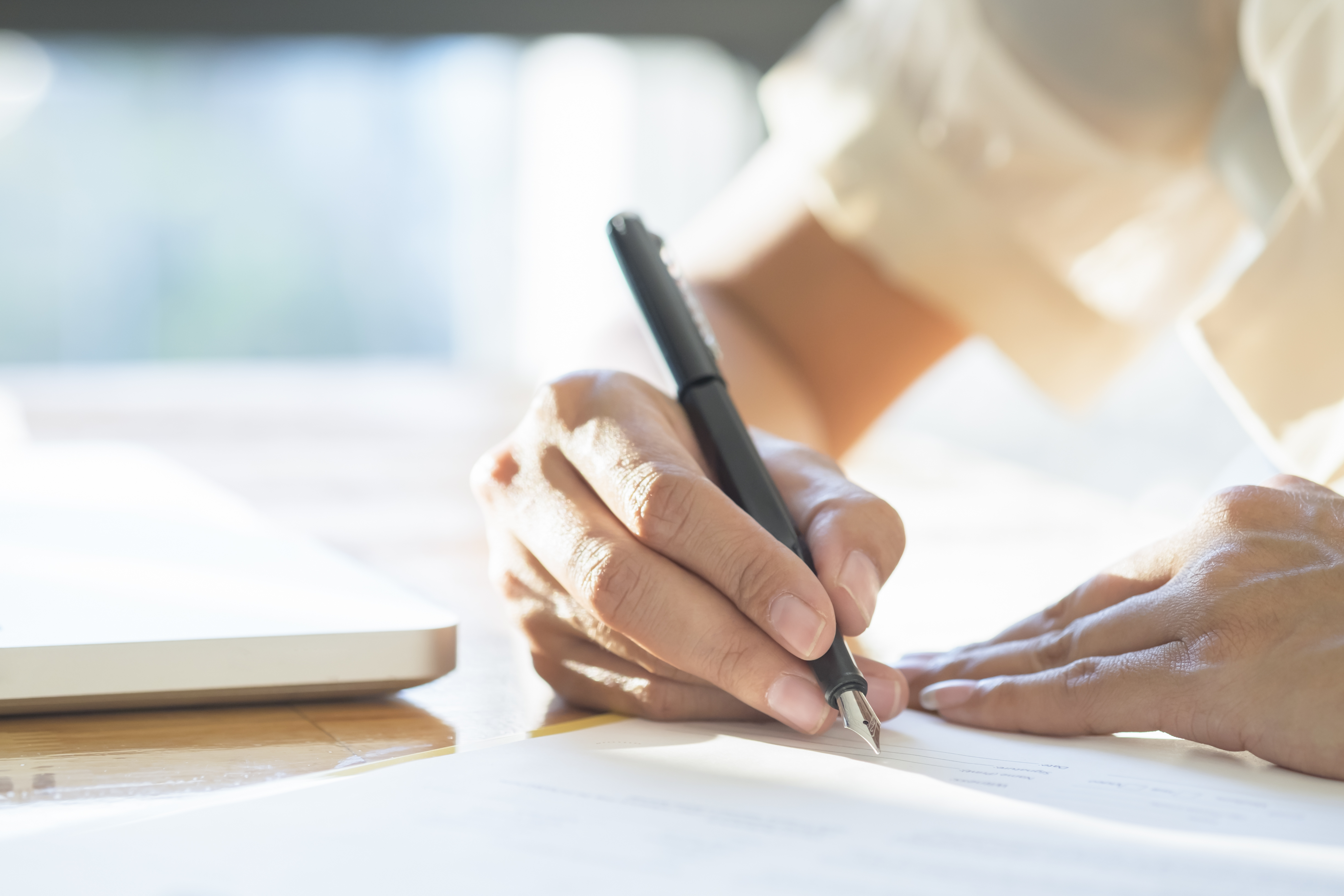 asian-business-woman-signing-a-contract-document-making-a-deal
